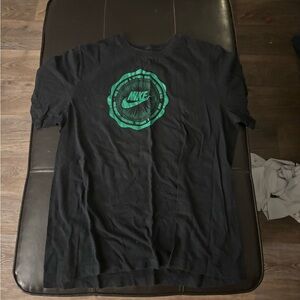 Black and green Nike shirt